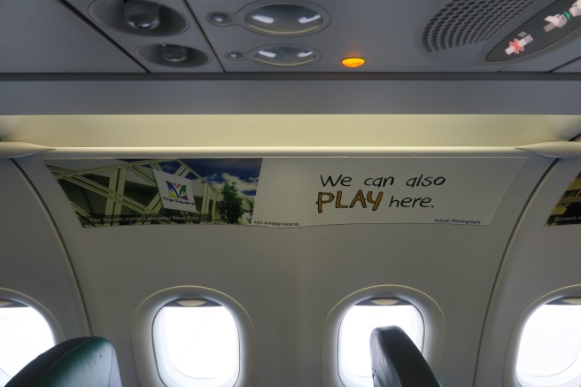 a sign on the window of an airplane