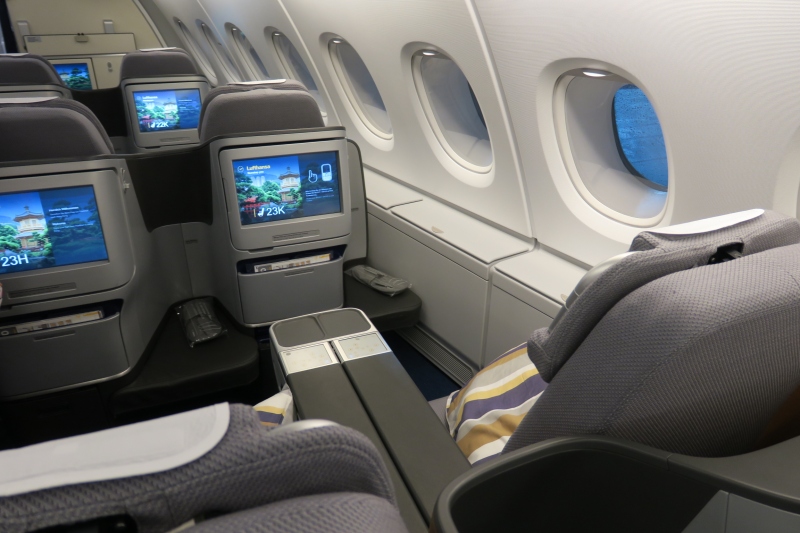 a seat and screen on the plane