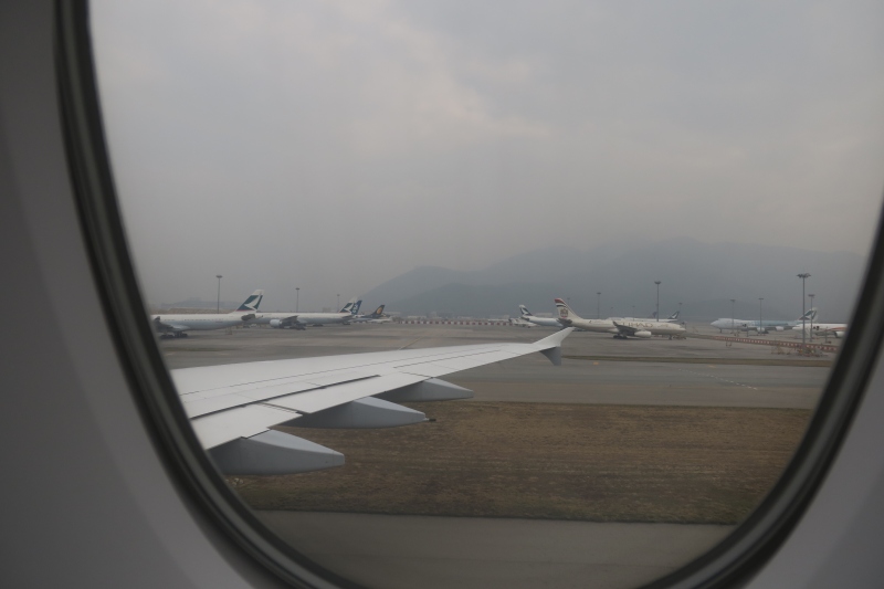 a view of airplanes on runway from a window