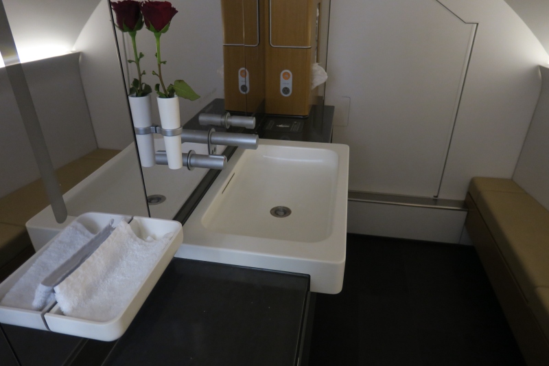 a sink with a flower in it