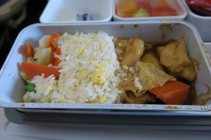 a tray of food with a container of food