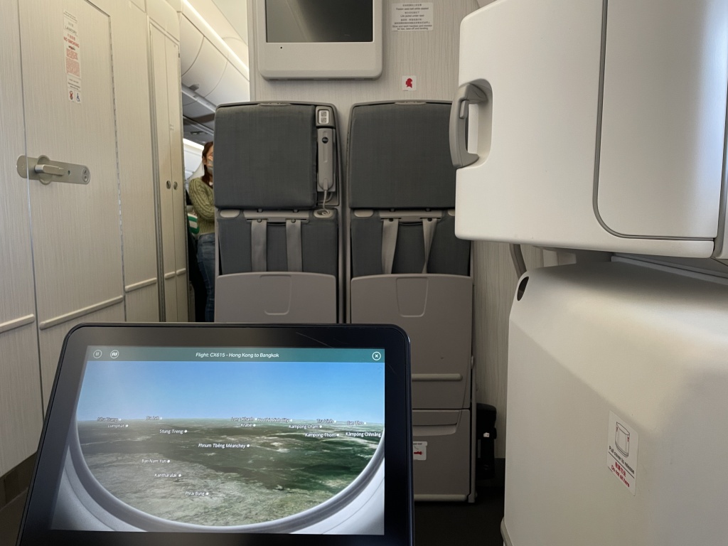 a computer screen in an airplane