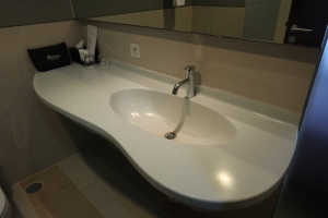 a sink with a curved edge