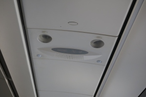 a white ceiling with a vent and a hole in the ceiling