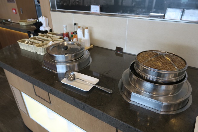 a counter with food containers and a spoon
