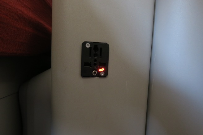 a black outlet with a red light