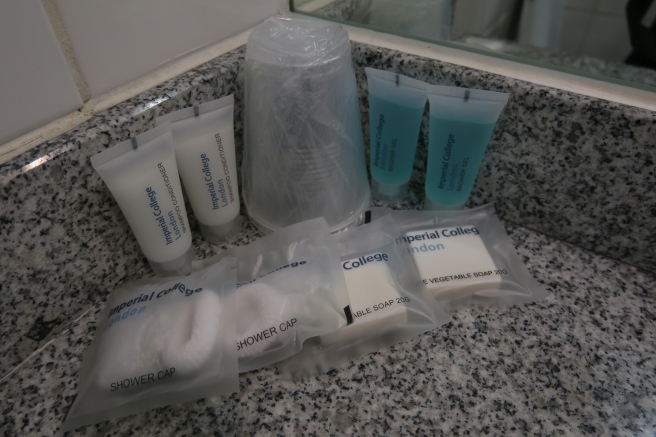 a group of toiletries and a cup
