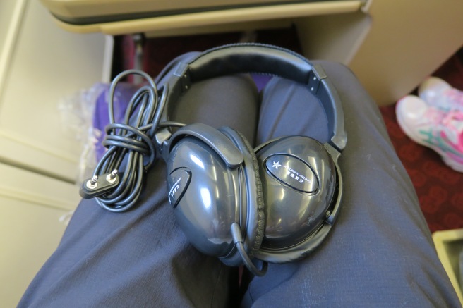 a pair of headphones on a person's lap