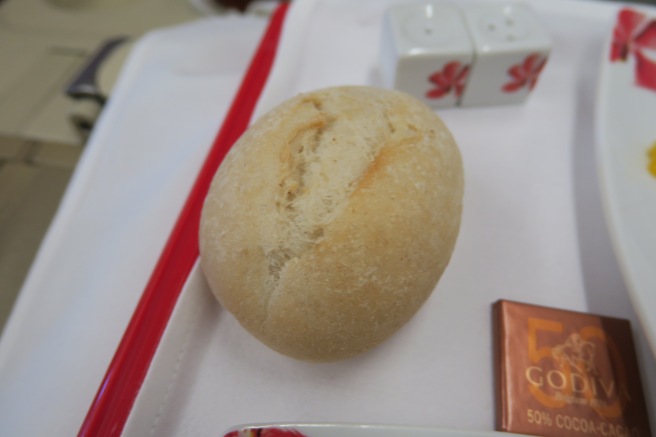 a roll on a plate