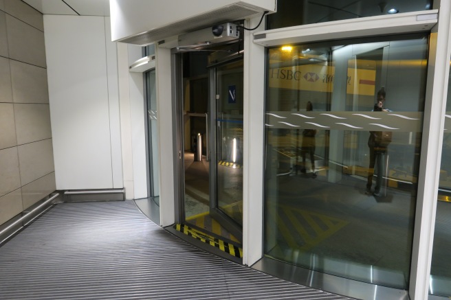 a glass doors with a sign on the side
