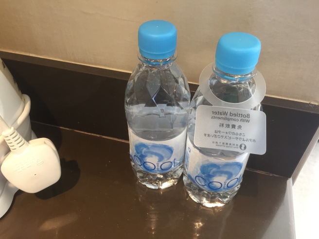 two bottles of water on a counter