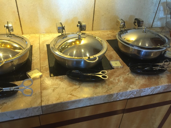 a group of metal bowls on a counter