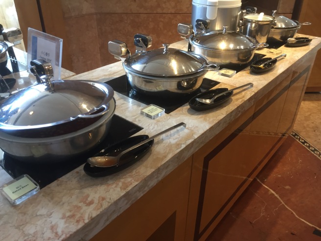 a group of pots and pans on a counter