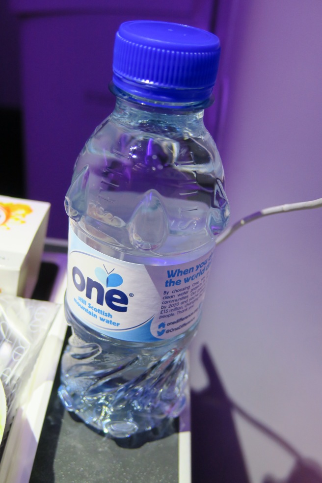a bottle of water with a blue cap