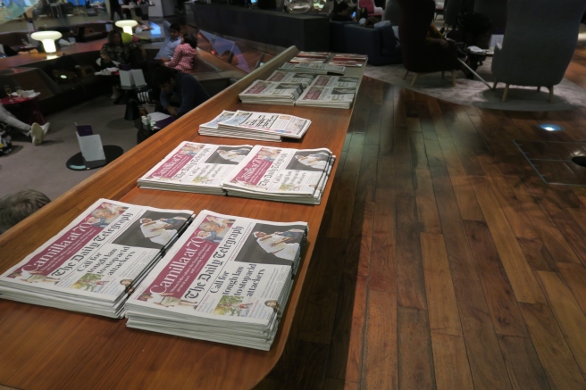 a row of newspapers on a table