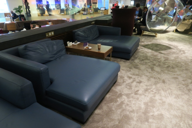a group of blue couches in a room