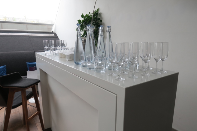 a group of empty glasses on a white counter