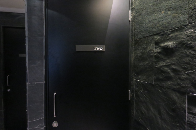 a black door with a silver handle