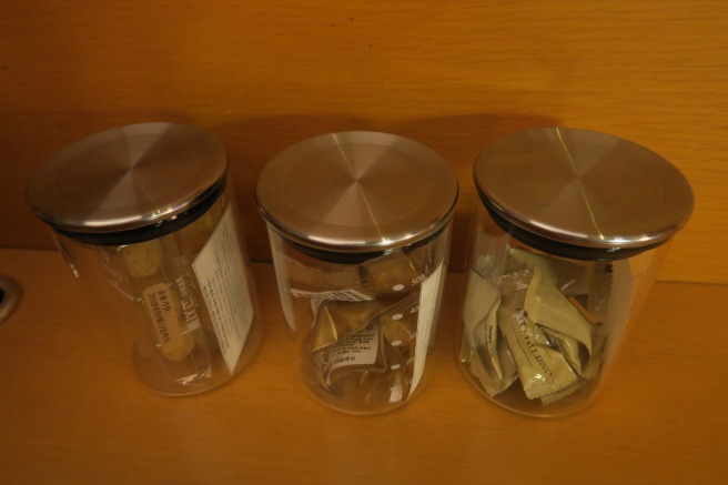a group of glass containers with lids