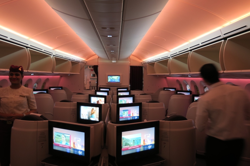 a row of televisions in an airplane