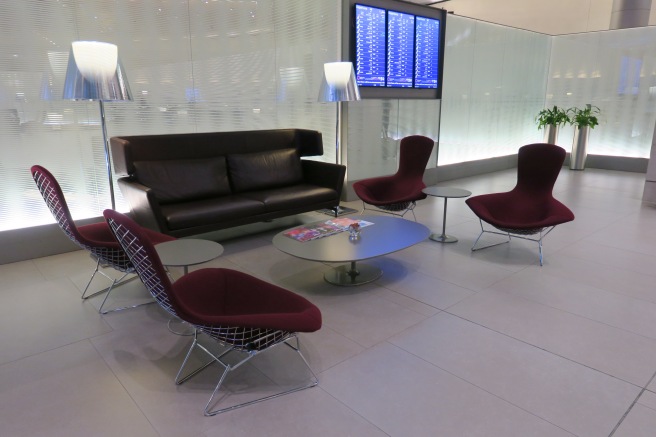 a lounge area with chairs and a table