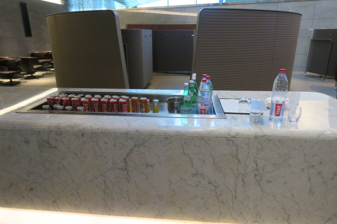 a counter with drinks and bottles