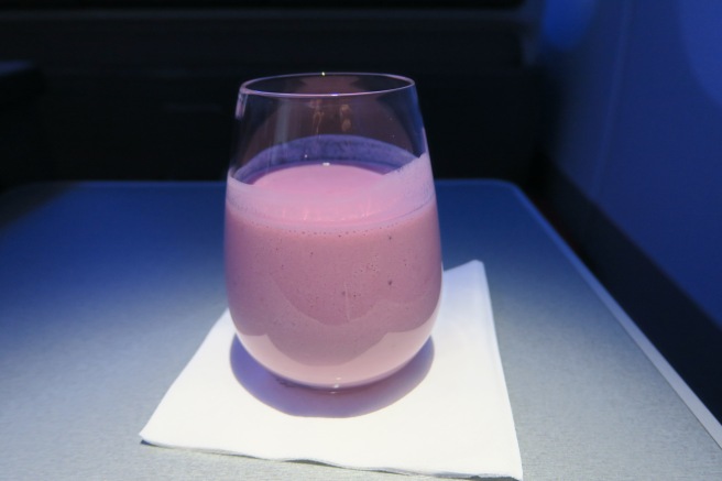 a glass of pink liquid