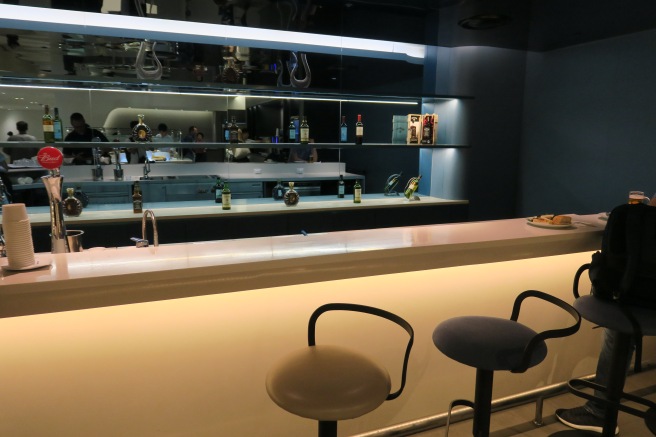 a bar with a counter and stools
