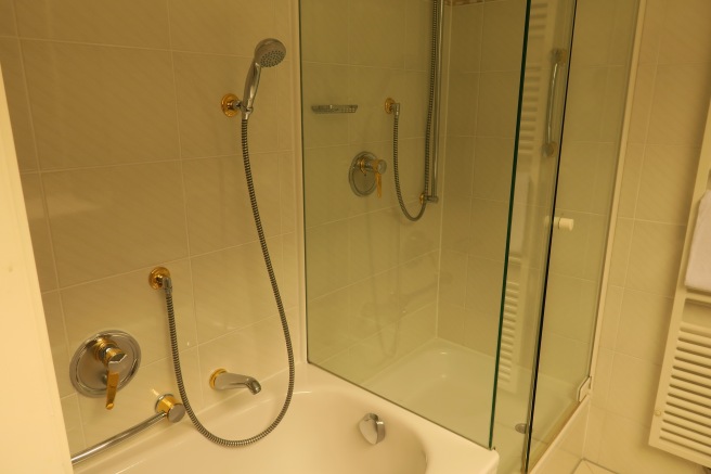 a shower and tub in a bathroom