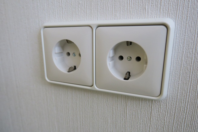 a white outlet on a wall