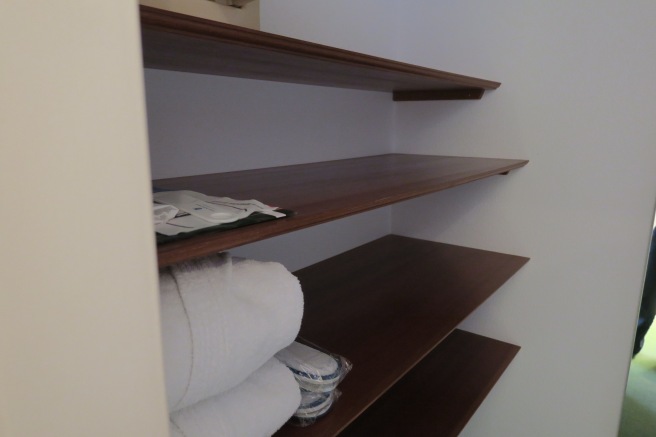 a shelf with towels and a towel on it