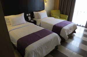 a couple of beds in a hotel room