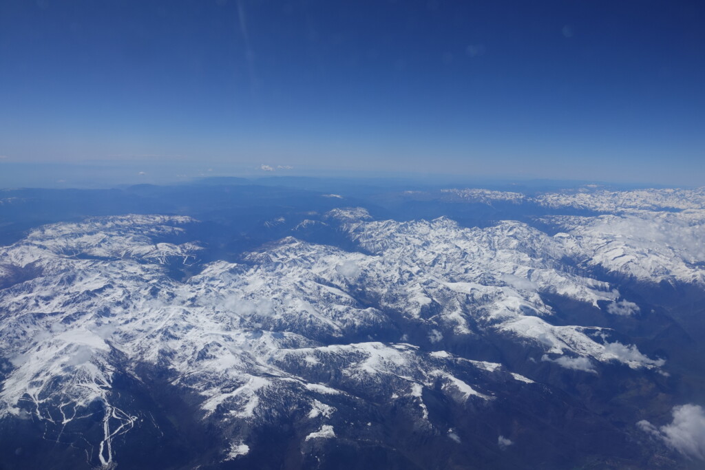 a aerial view of snow covered mountains