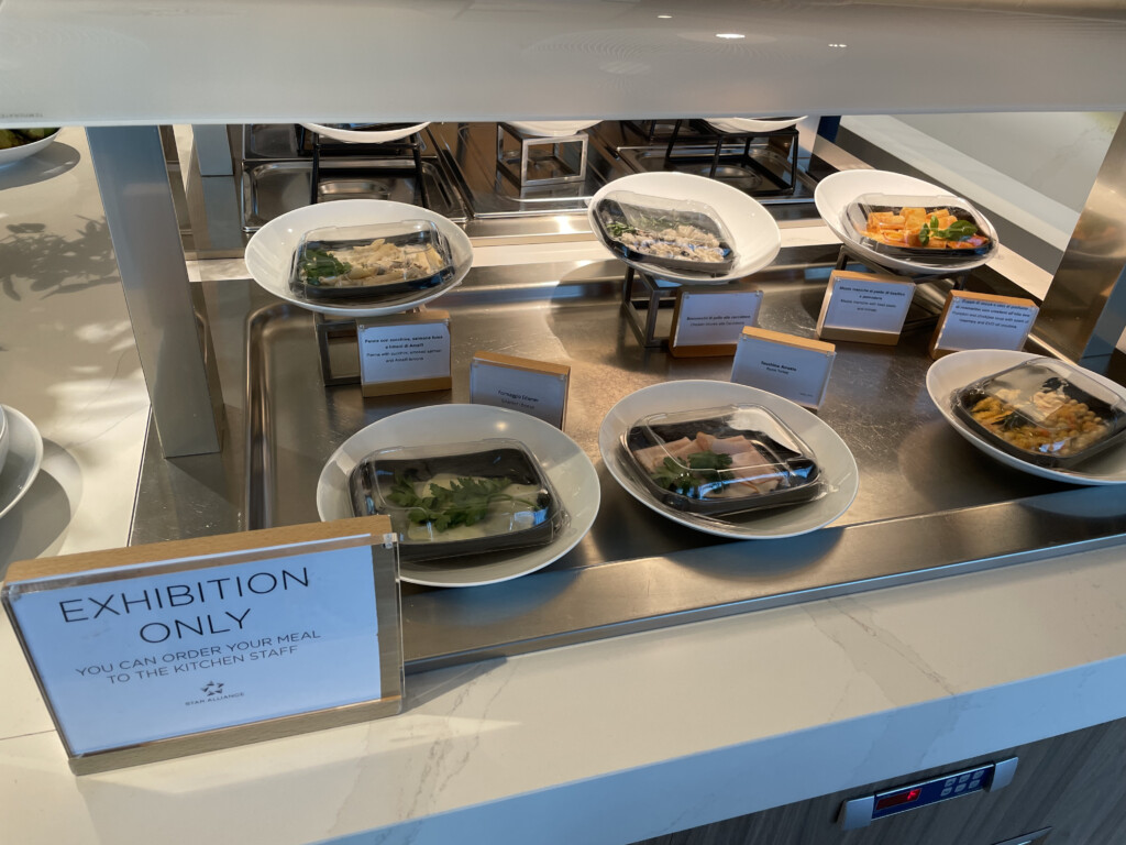 a group of plates of food on a counter
