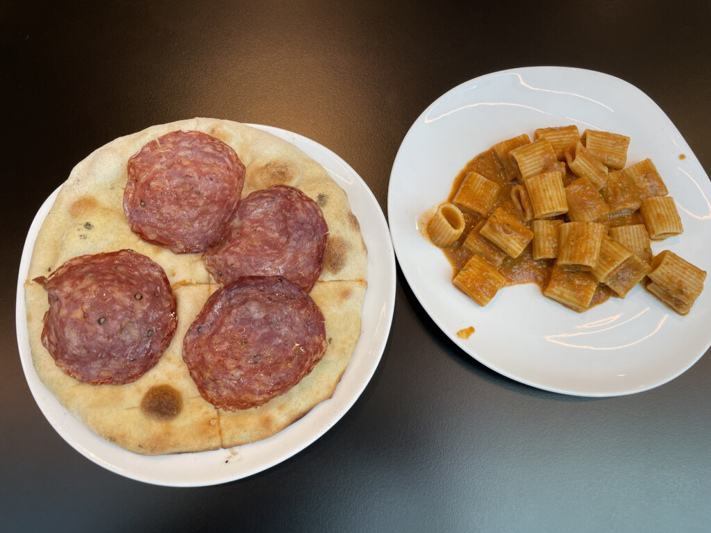 a plate of pasta and pizza