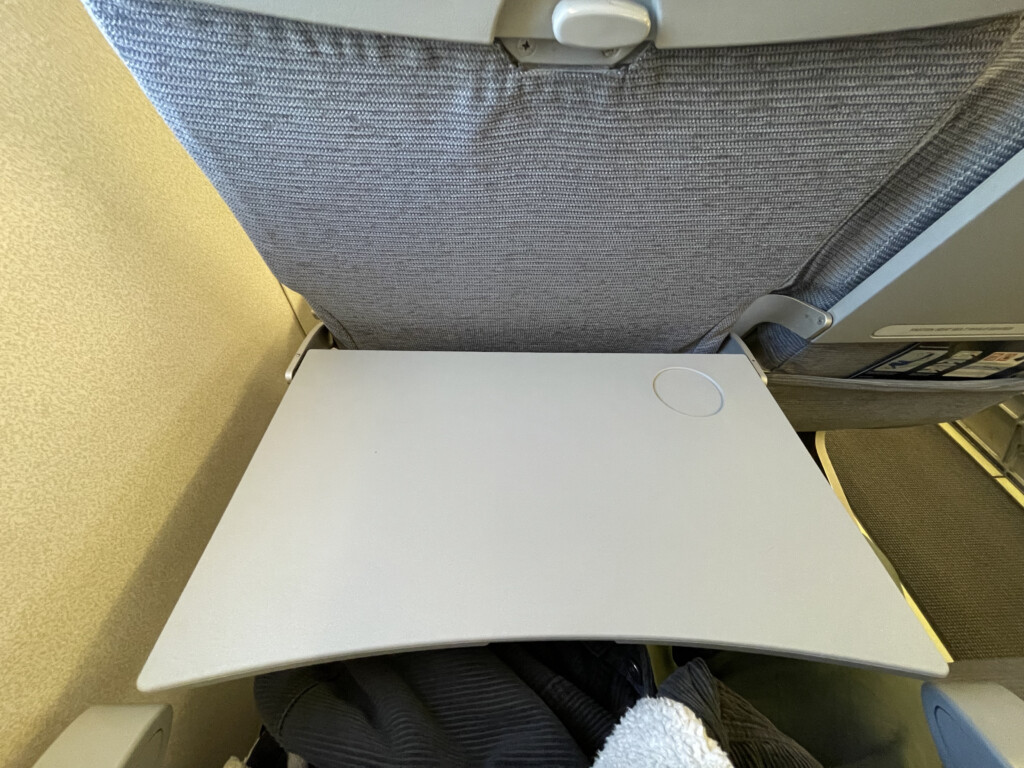 a laptop on an airplane seat