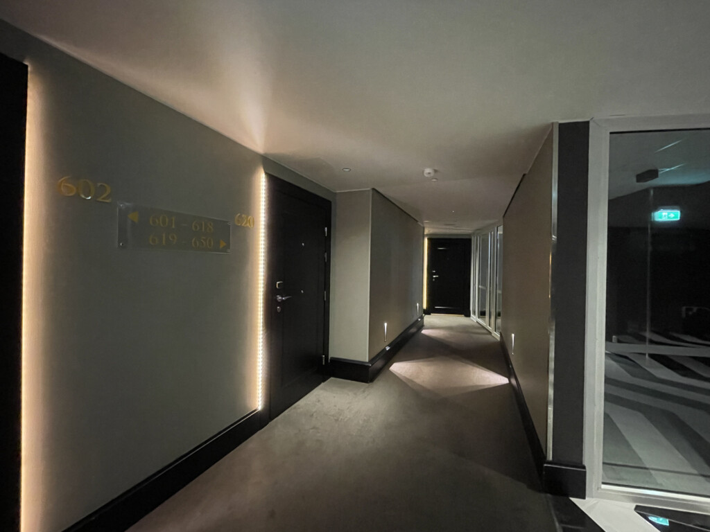 a hallway with lights on the walls