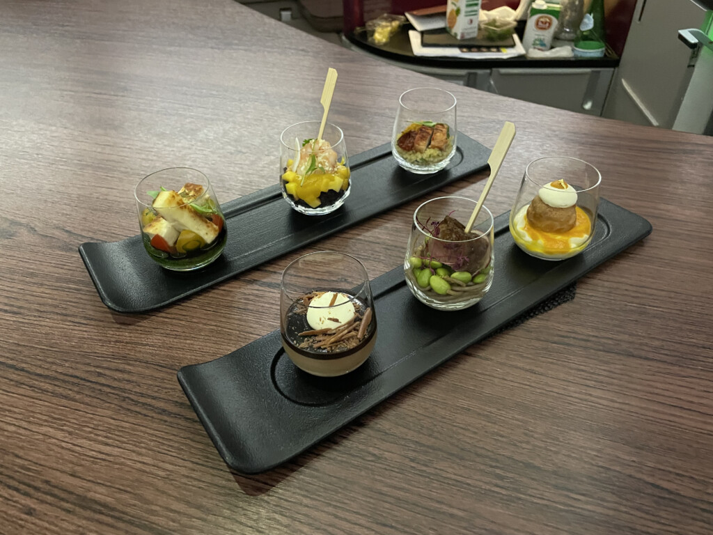 a group of small glasses of food on a table