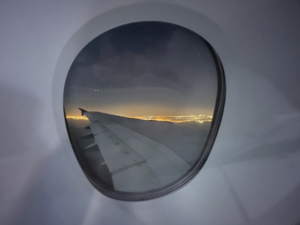 a view of the wing of an airplane from a plane window