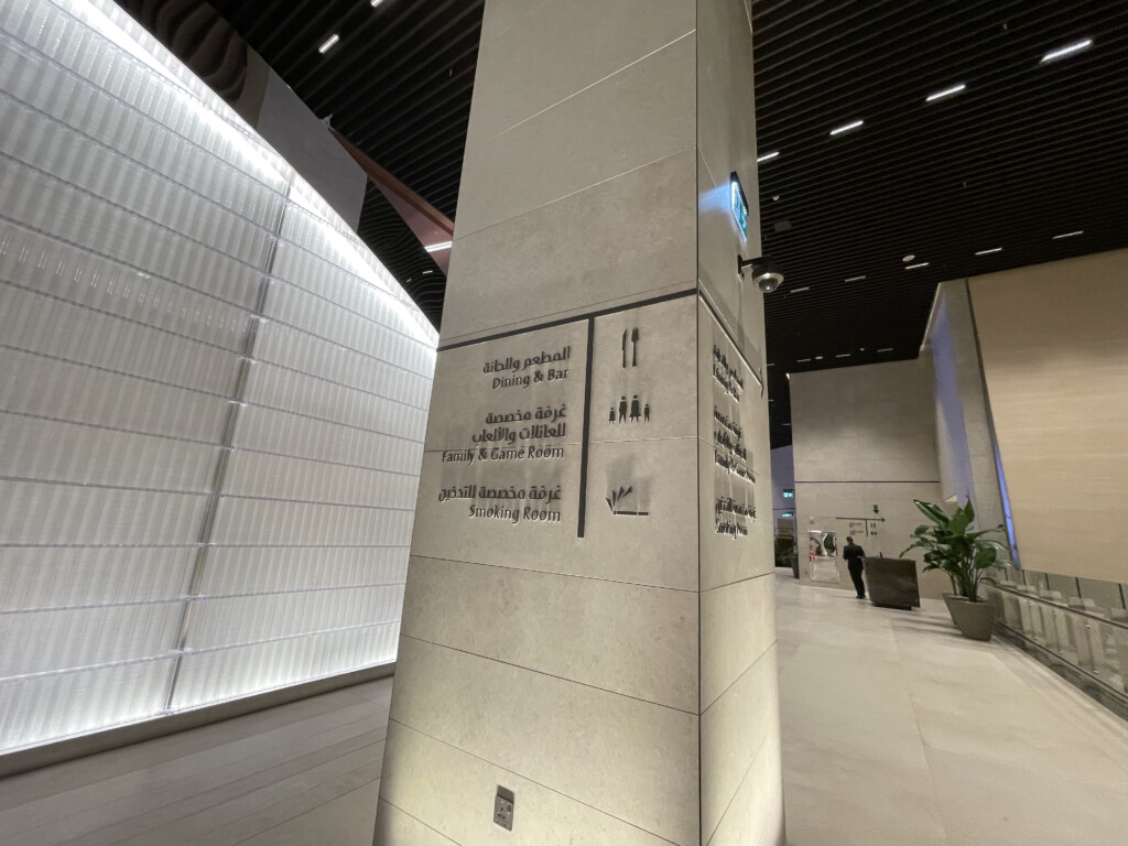 a tall white pillar with writing on it