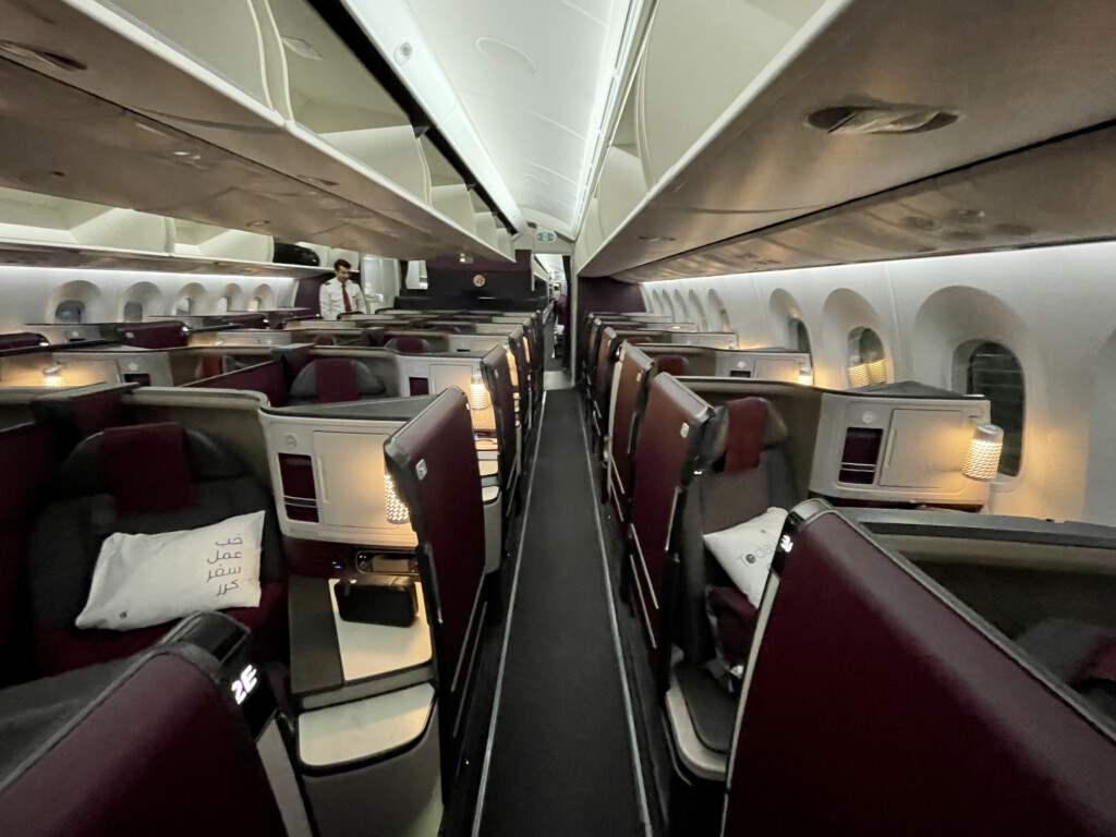 inside an airplane with rows of seats