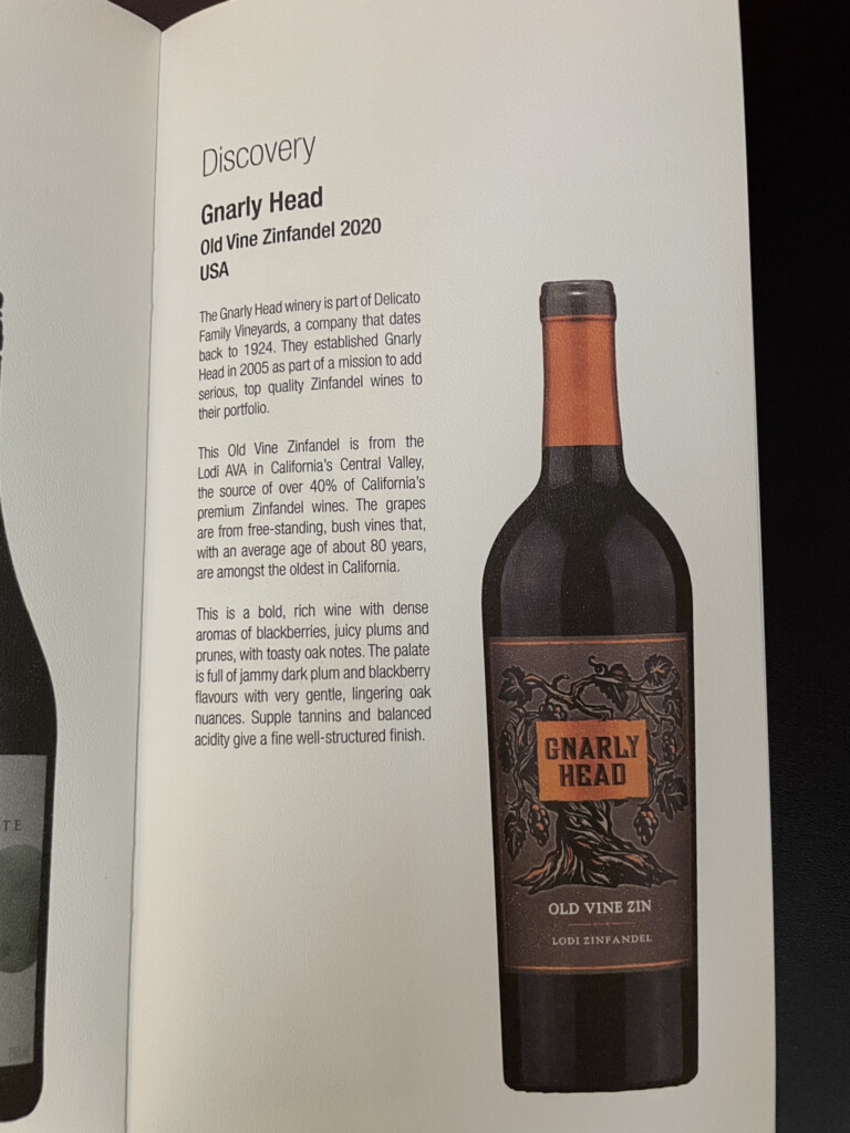 a book with a bottle of wine