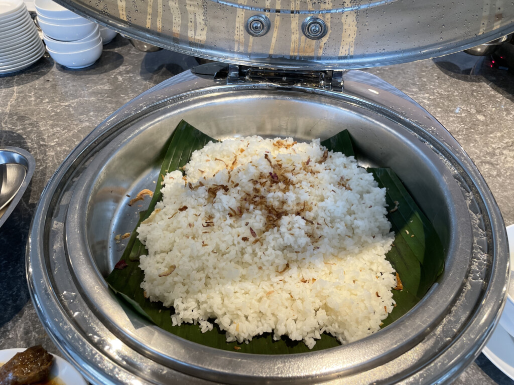 a bowl of rice on a leaf