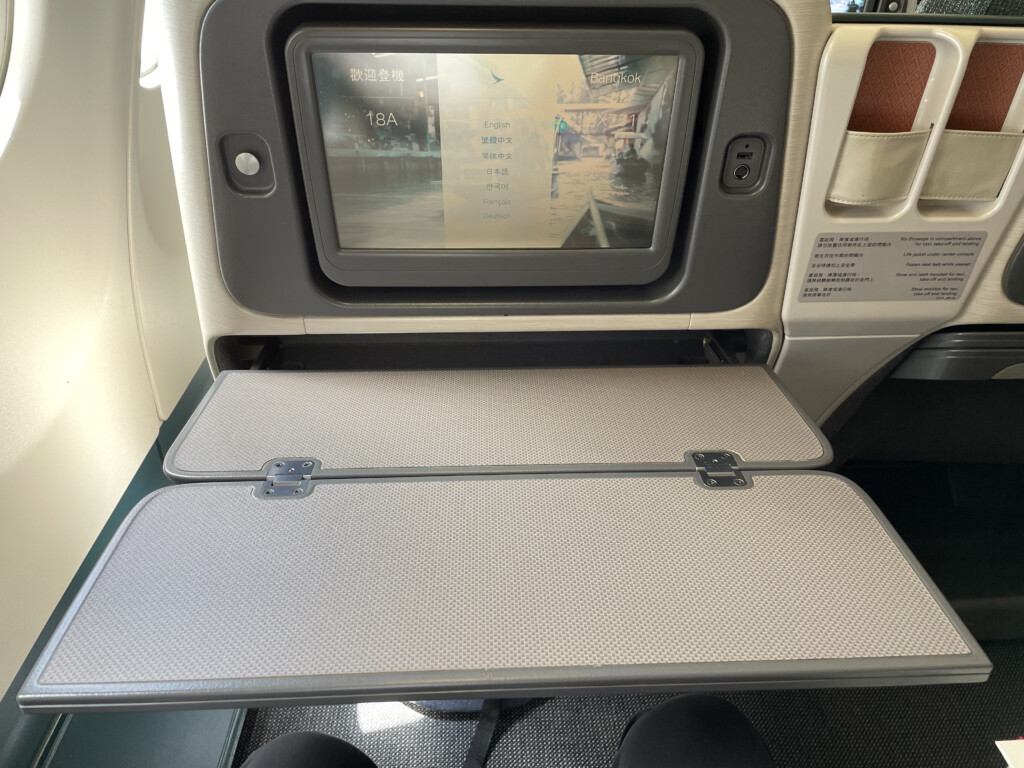 an airplane seat with a screen