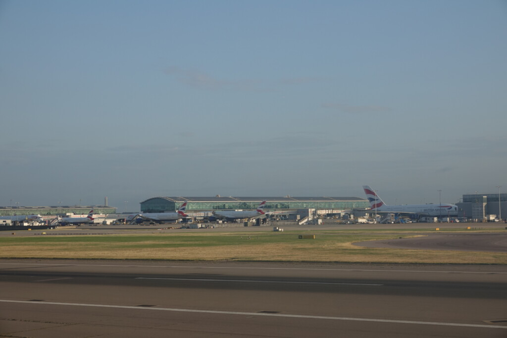a airport with airplanes on the runway