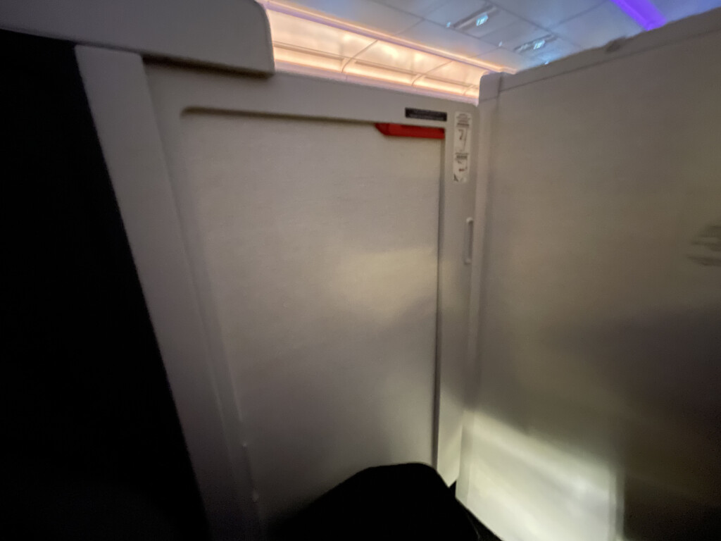 a white refrigerator in an airplane