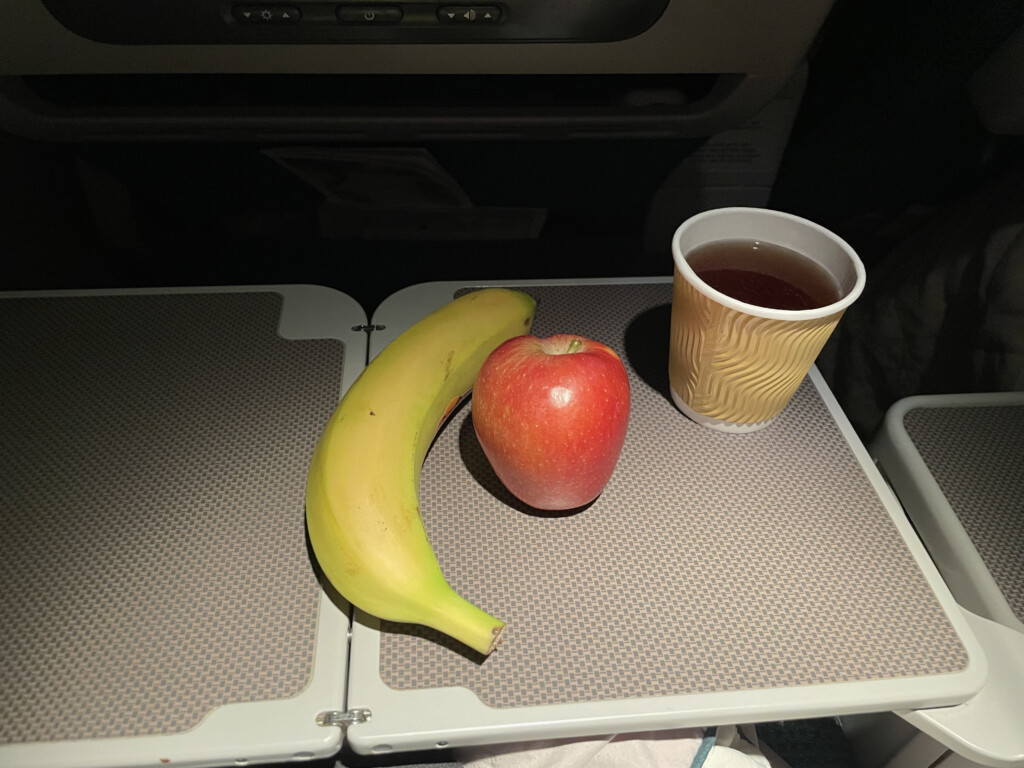 a banana and apple on a tray