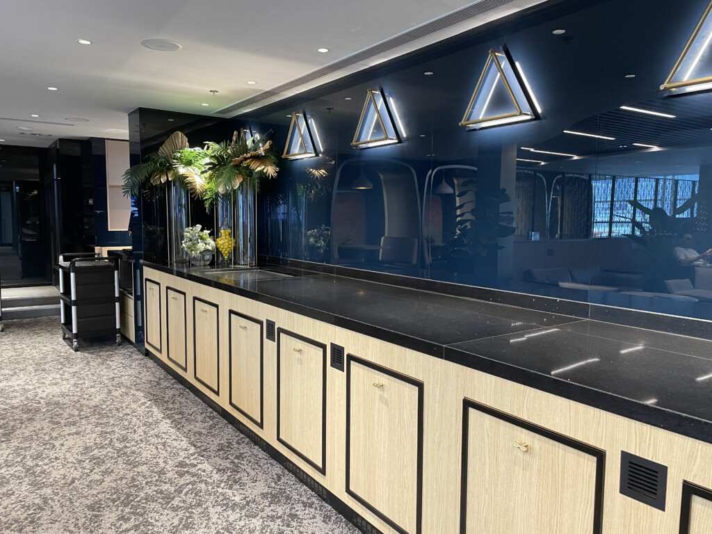a black counter with white cabinets and black counter tops