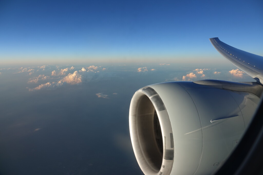 a plane engine and clouds