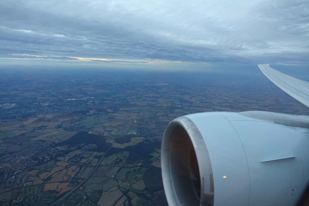 an airplane wing and a landscape